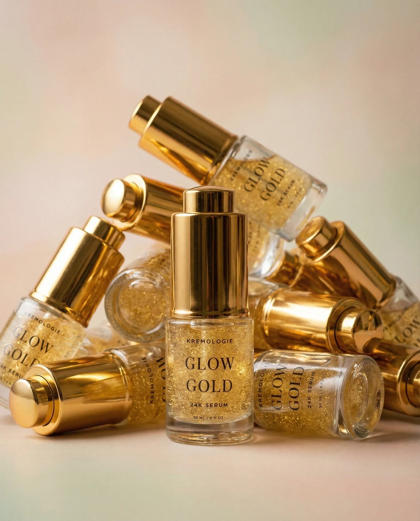 Gold skincare serum bottles with 'Glow Gold' text on a gradient background