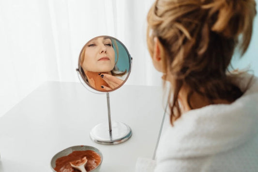 Woman with sensitive reactive skin choosing an anti-aging skincare routine designed for visible aging without unnecessary irritation