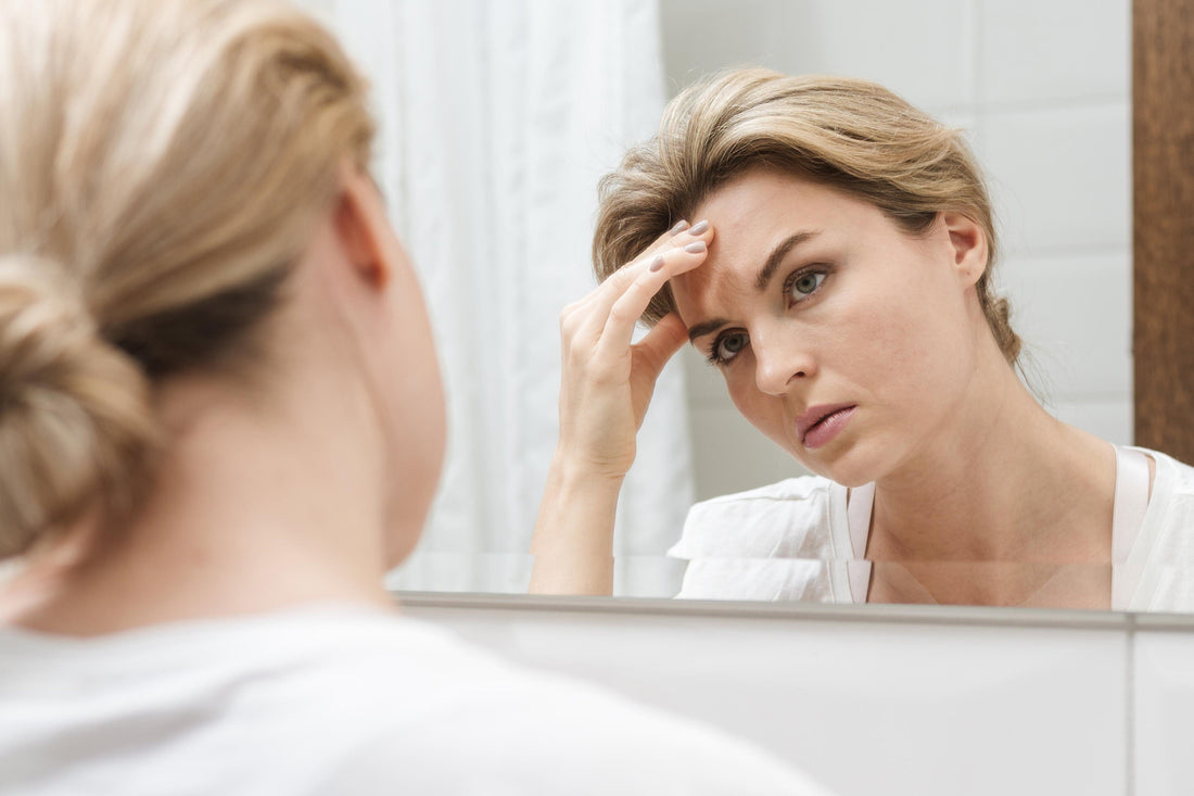 Woman with sensitive reactive skin noticing signs of skin barrier support
