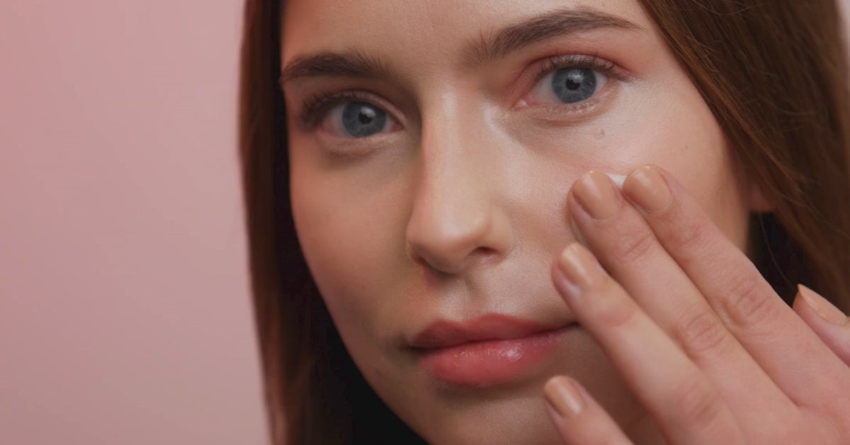 Load video: woman applying face cream